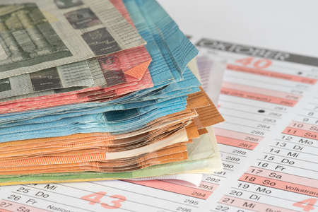 A calendar and euro bills