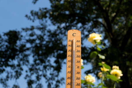 Thermometer shows high temperature in summer