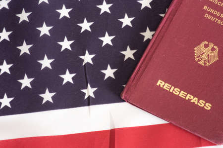 Flag of the USA and a german passportの写真素材