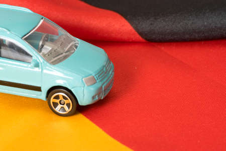 A car and the flag of Germanyの写真素材