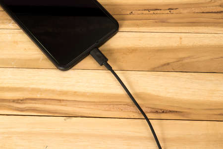 A cellphone is chargedの写真素材