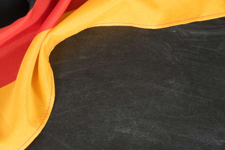 Flag of Germany and black chalk board as a template for editing