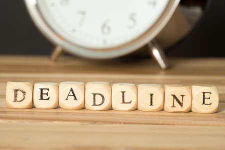 An alarm clock and the word deadlineの写真素材