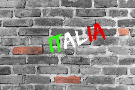 Word Italy on an old, cracked wallの写真素材