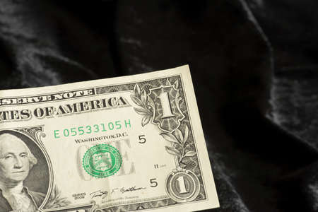 One dollar bill on black backgroundの写真素材