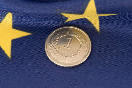 Coin Polish zloty PLN and the flag of the European Union EUの写真素材