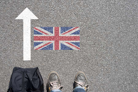 A man with the suitcase travels to the UK concept photo A man with the suitcase travels to the UK concept photo