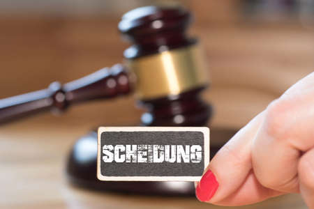 A judge gavel, wife and divorce