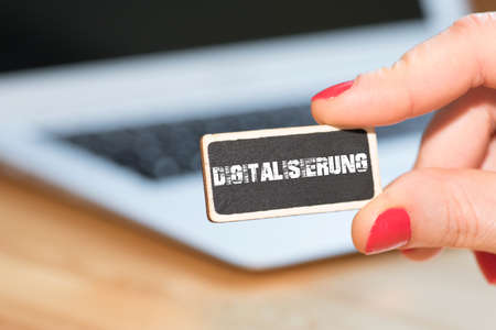 A woman, a laptop and digitizationの写真素材