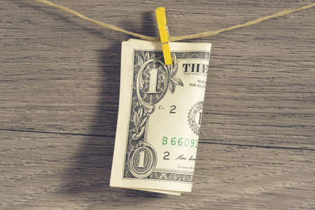 Dollar banknote on a clotheslineの写真素材