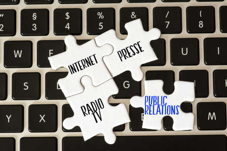 A computer, puzzle and public relationsの写真素材