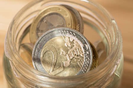 Euro coins in a jar