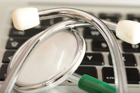A stethoscope on a laptopの写真素材