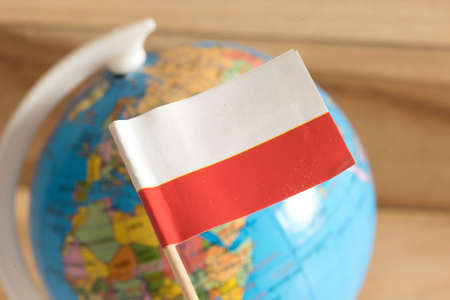Flag of Poland and a globe in the backgroundの写真素材