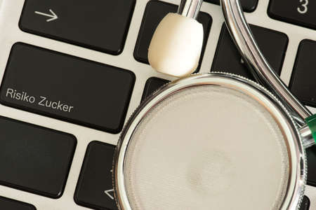 A stethoscope, computer and button for risk sugar