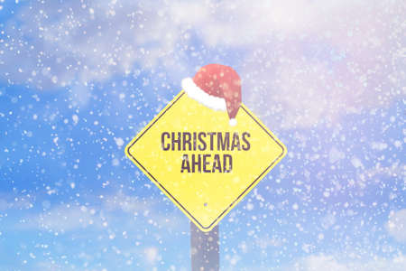 Winter, snow and a sign with the phrase Christmas Aheadの写真素材
