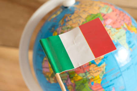 Flag of Italy and globe in the backgroundの写真素材