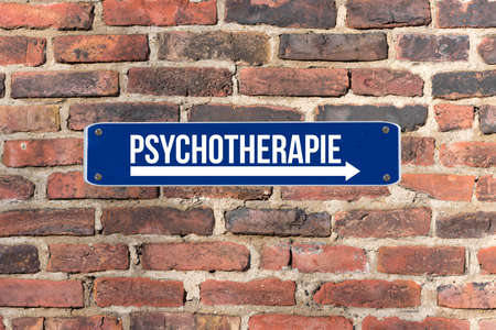 A sign on a wall indicates psychotherapy