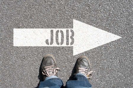 A man and an arrow towards the jobの写真素材