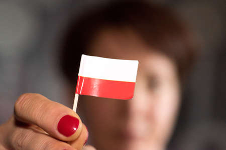A woman and the flag of Polandの写真素材