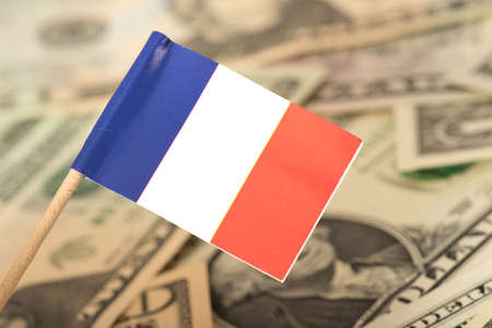Flag of France and dollar bills in the backgroundの写真素材