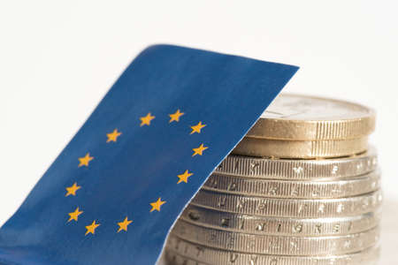 Flag of the European Union EU and Euro coins