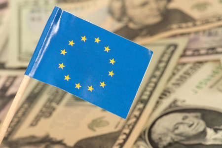 European union flag EU and dollar bills in the background