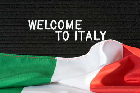 Italian flag and slogan Welcome to Italyの写真素材