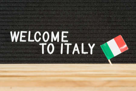 Italian flag and slogan Welcome to Italyの写真素材
