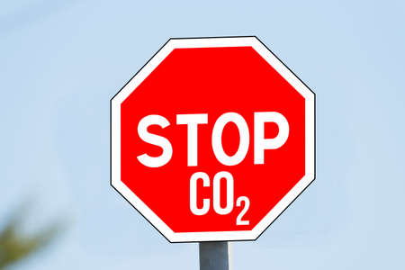 A stop sign and the abbreviation CO2 for carbon dioxide