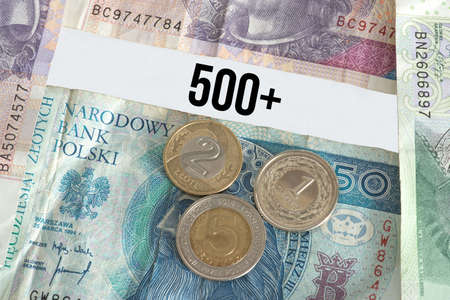 Banknotes and coins Polish zloty PLN and child support in Poland 500+