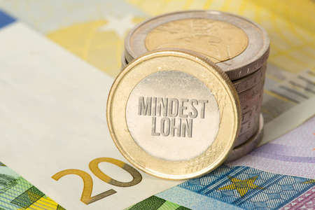 Euro bills and coins and the minimum wageの写真素材