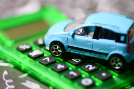 A car on a calculatorの写真素材