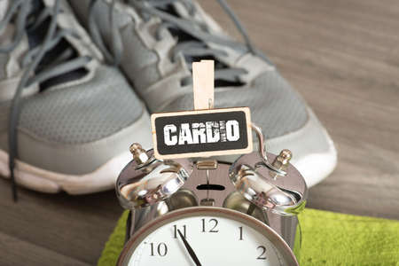 Running shoes, alarm clock and shield cardioの写真素材