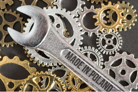 Spanner, gears and shield Made in Polandの写真素材
