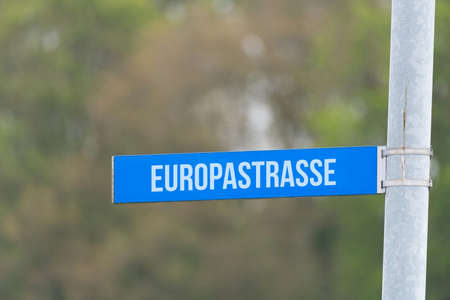 A road sign points to European road