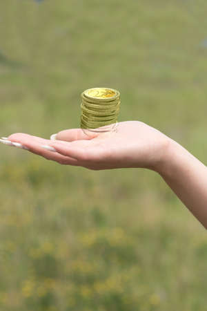 A woman has coin on the handの写真素材