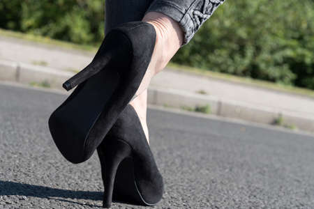 A young woman and high heelsの写真素材