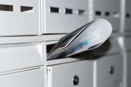 A newspaper in a mailbox