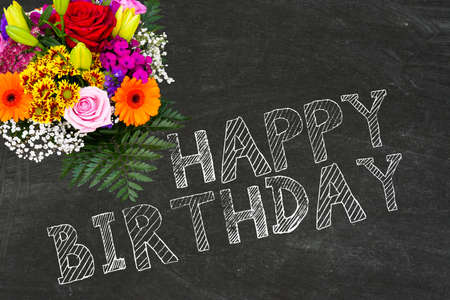A bouquet of flowers and a happy birthdayの写真素材
