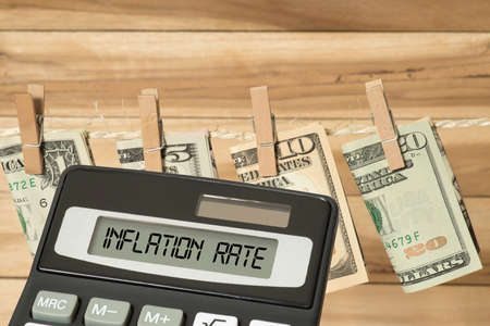 Dollar bills, calculator and inflation in America