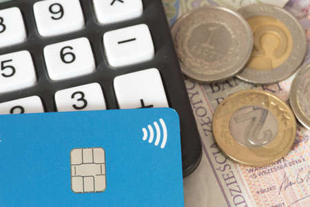 Calculator, money Polish zloty PLN and a credit card