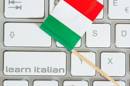 Computer, flag of Italy and learning Italianの写真素材