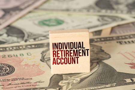 Dollar banknotes and IRA Individual Retirement Accountの写真素材