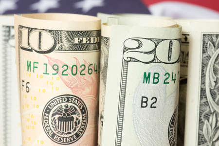Dollar bills and flag of USA