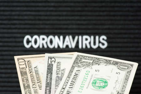 Dollar banknotes and corona virus in Americaの写真素材