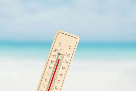 Beach and thermometer in summerの写真素材