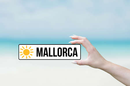 Beach, vacation and a woman with the sign Mallorca