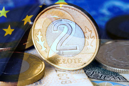 Polish zloty PLN coin and European Union flag