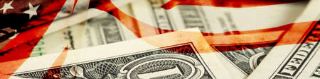 Dollar banknotes and flag USAの写真素材